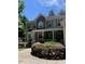 Two-story home with stone accents, welcoming porch, and lush landscaping at 1620 Dunn Rd, Raleigh, NC 27614
