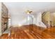 Spacious living room with hardwood floors and stone fireplace at 1620 Dunn Rd, Raleigh, NC 27614