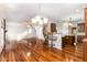Sunlit living room showcasing hardwood floors and stone fireplace at 1620 Dunn Rd, Raleigh, NC 27614
