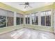 Bright sunroom with tile floors and multiple windows at 1620 Dunn Rd, Raleigh, NC 27614