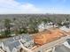 An aerial view of the new construction home and neighborhood with the city skyline in the background at 2642 Marchmont St, Raleigh, NC 27608