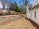 Large backyard with a retaining wall shows the blank slate for outdoor design opportunities at 2642 Marchmont St, Raleigh, NC 27608