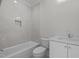 Bathroom featuring a tub, toilet, and countertop sink at 2642 Marchmont St, Raleigh, NC 27608