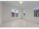 Bedroom with carpet, bright light, and three windows at 2642 Marchmont St, Raleigh, NC 27608