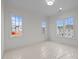 Bedroom with carpet, bright light, and three windows at 2642 Marchmont St, Raleigh, NC 27608