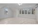 Well-lit bonus room with large windows and detailed trim work at 2642 Marchmont St, Raleigh, NC 27608