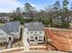 New construction features brick, light stone, and a long driveway leading to the garage at 2642 Marchmont St, Raleigh, NC 27608