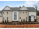 Exterior of home showcasing architectural details, manicured landscaping, and brick and siding facade at 2642 Marchmont St, Raleigh, NC 27608