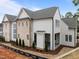 Rear view of new home, showcasing the architecture, professional landscaping, and outdoor living space at 2642 Marchmont St, Raleigh, NC 27608
