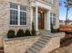 Welcoming front entrance with stately columns, detailed brickwork, and elegant stone steps at 2642 Marchmont St, Raleigh, NC 27608