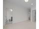 Hallway featuring tile floors with doors leading to additional rooms in the house at 2642 Marchmont St, Raleigh, NC 27608