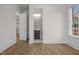 Hallway with views to a powder room and other rooms at 2642 Marchmont St, Raleigh, NC 27608