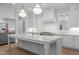 Spacious kitchen with stainless steel appliances, large marble island, and custom cabinetry at 2642 Marchmont St, Raleigh, NC 27608
