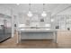 Spacious kitchen with stainless steel appliances, large marble island, and custom cabinetry at 2642 Marchmont St, Raleigh, NC 27608
