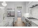 View of Kitchen, looking through to the dining room at 2642 Marchmont St, Raleigh, NC 27608
