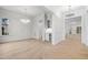 Bright, open-concept living room with hardwood floors, elegant lighting, and a built-in bar at 2642 Marchmont St, Raleigh, NC 27608