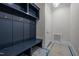 Convenient mudroom with built-in storage, coat hooks, and a bench at 2642 Marchmont St, Raleigh, NC 27608