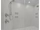 Modern shower with white subway tile, dual shower heads, and built-in recessed shelving at 2642 Marchmont St, Raleigh, NC 27608
