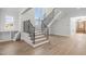 Foyer featuring staircase, natural light and hardwood floors at 2642 Marchmont St, Raleigh, NC 27608