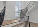 Elegant staircase with wrought iron railings and hardwood steps at 2642 Marchmont St, Raleigh, NC 27608