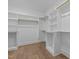 Large walk-in closet with extensive shelving and hanging space, complemented by wood floors at 2642 Marchmont St, Raleigh, NC 27608