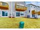 Townhome backyard with freshly seeded grass, patios and wood balconies at 2729 Hunter Woods Dr # 568, Apex, NC 27502