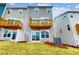 This home features a backyard with a wooden deck and sliding glass doors for easy access at 2729 Hunter Woods Dr # 568, Apex, NC 27502