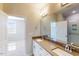 Bathroom featuring double sinks and a shower with glass door at 2729 Hunter Woods Dr # 568, Apex, NC 27502
