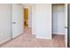 Bedroom with neutral walls and carpet. Closet has ample space for storage at 2729 Hunter Woods Dr # 568, Apex, NC 27502