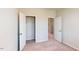 Bedroom featuring neutral carpet, two closets and a doorway to another room at 2729 Hunter Woods Dr # 568, Apex, NC 27502