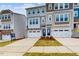 Attractive townhome facade with a two-car garage, and neatly manicured landscaping at 2729 Hunter Woods Dr # 568, Apex, NC 27502