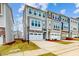 Charming townhome with stone accents, a two-car garage, and professionally landscaped front yard at 2729 Hunter Woods Dr # 568, Apex, NC 27502