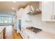 Well appointed kitchen with stainless appliances, herringbone backsplash, and an open floor plan at 2729 Hunter Woods Dr # 568, Apex, NC 27502