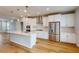 Contemporary kitchen with an island, stainless steel appliances, and sleek white cabinetry at 2729 Hunter Woods Dr # 568, Apex, NC 27502