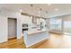 Bright, modern kitchen with stainless steel appliances, a large island, and ample counter space at 2729 Hunter Woods Dr # 568, Apex, NC 27502