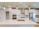 Stylish kitchen with pendant lighting over the island, stainless appliances, and white cabinets at 2729 Hunter Woods Dr # 568, Apex, NC 27502