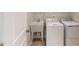 Laundry room features a utility sink and white washer and dryer machines at 2729 Hunter Woods Dr # 568, Apex, NC 27502