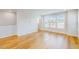 Open-concept living area with hardwood floors, large windows, and plenty of natural light at 2729 Hunter Woods Dr # 568, Apex, NC 27502