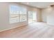 Living room with neutral carpet and large windows and door leading to outdoor patio at 2729 Hunter Woods Dr # 568, Apex, NC 27502