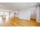 Spacious living room with hardwood floors and access to the modern kitchen at 2729 Hunter Woods Dr # 568, Apex, NC 27502