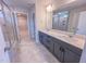 Bathroom features double sink vanity, a glass shower, and access to the walk in closet at 320 Duncan Creek Rd # 161, Lillington, NC 27546