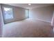 Carpeted bedroom featuring natural light from two windows at 320 Duncan Creek Rd # 161, Lillington, NC 27546