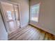 Bright bedroom with a window and a sliding glass door offering a view of the outdoors at 320 Duncan Creek Rd # 161, Lillington, NC 27546