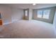 Bright bedroom with soft carpeting and ample natural light from well-placed windows at 320 Duncan Creek Rd # 161, Lillington, NC 27546