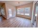 Well-lit dining room with modern chandelier, large windows, and access to an outdoor space at 320 Duncan Creek Rd # 161, Lillington, NC 27546