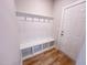 Stylish entryway featuring a built-in hall tree with coat hooks, bench, and cubbies near the front door at 320 Duncan Creek Rd # 161, Lillington, NC 27546