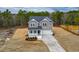 Charming two-story home with a welcoming front porch and attached two-car garage at 320 Duncan Creek Rd # 161, Lillington, NC 27546