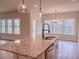 Bright, open kitchen featuring granite island and stainless steel appliances with views to the outside at 320 Duncan Creek Rd # 161, Lillington, NC 27546
