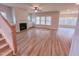 Open-concept living area with fireplace, built-in cabinets, and wood flooring at 320 Duncan Creek Rd # 161, Lillington, NC 27546