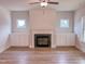 Inviting living room with fireplace, built-in storage, and wood-look flooring at 320 Duncan Creek Rd # 161, Lillington, NC 27546